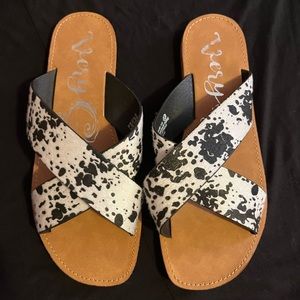 Brand new cow print flip flops
